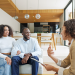 A professional real estate agent conducting a strategic home buying consultation with a client in a modern coffee shop.